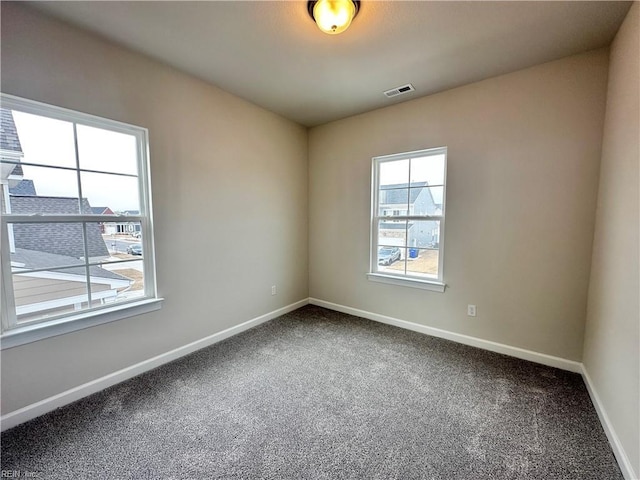 unfurnished room featuring carpet flooring