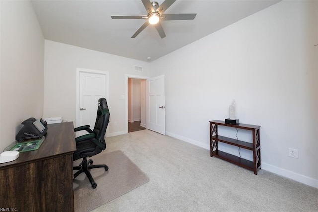 carpeted home office with ceiling fan