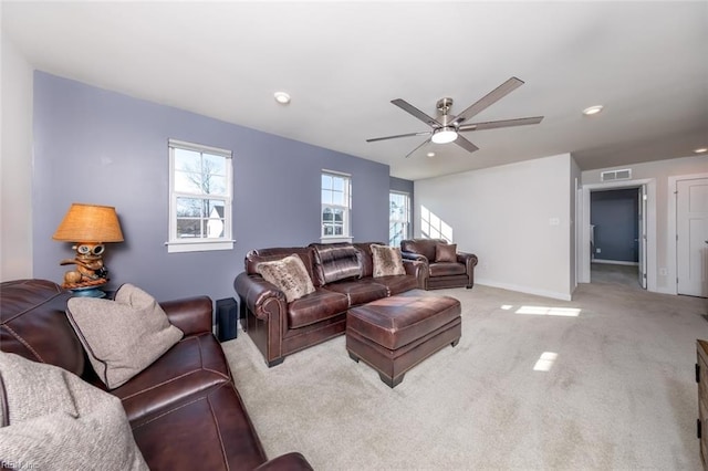 living room featuring ceiling fan and light carpet