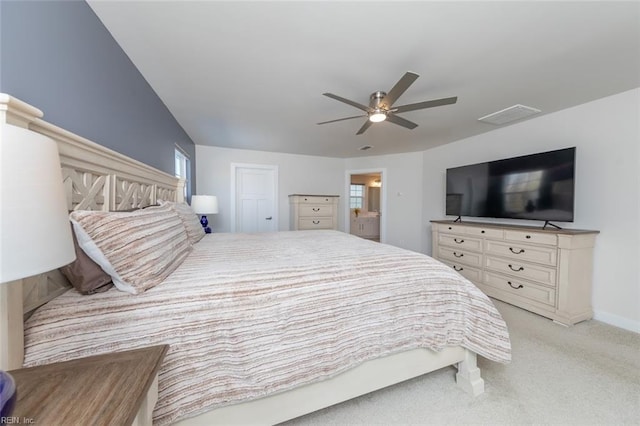 carpeted bedroom featuring ceiling fan and a closet