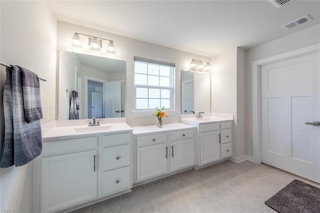 bathroom featuring tile patterned floors and vanity