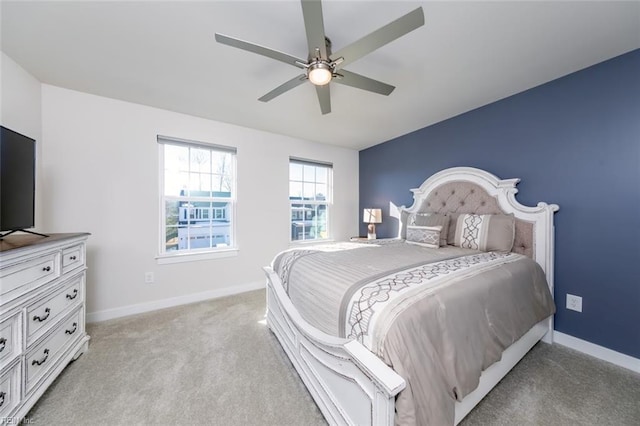 bedroom featuring ceiling fan and light carpet