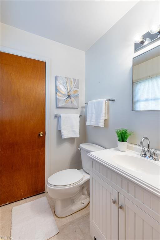 bathroom with toilet and vanity