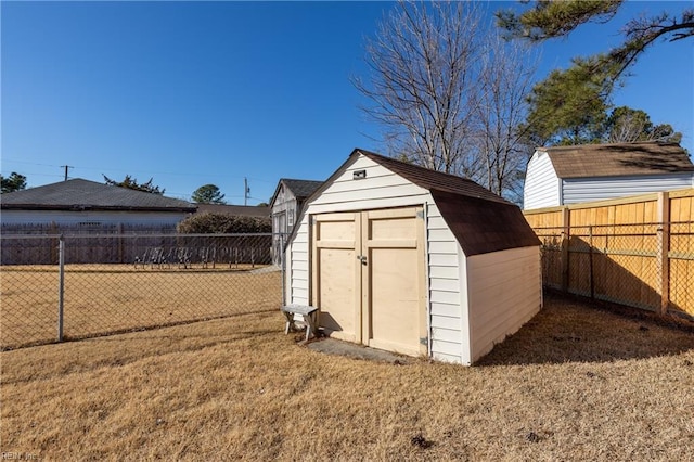 view of outbuilding featuring a yard