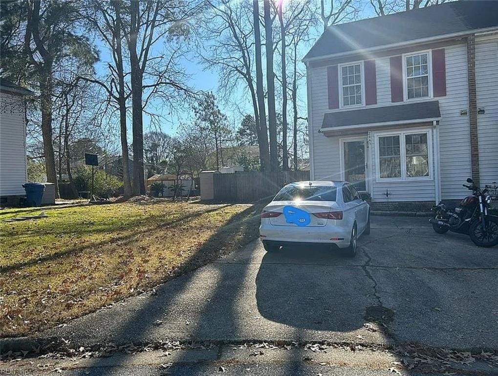 view of side of home featuring a yard