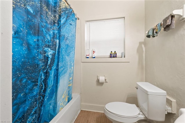 bathroom with toilet, shower / bath combination with curtain, and hardwood / wood-style flooring