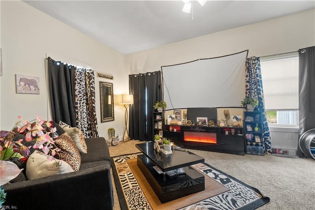 living room featuring ceiling fan and carpet floors