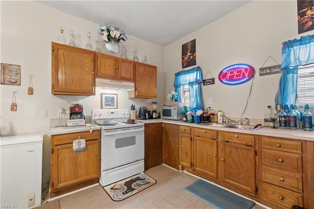 kitchen featuring sink and white appliances