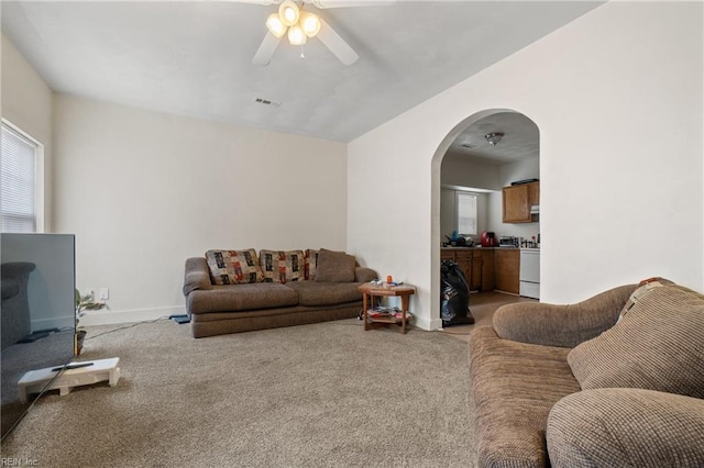 carpeted living room featuring ceiling fan