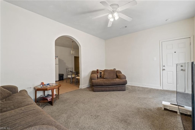 living room with ceiling fan and carpet floors