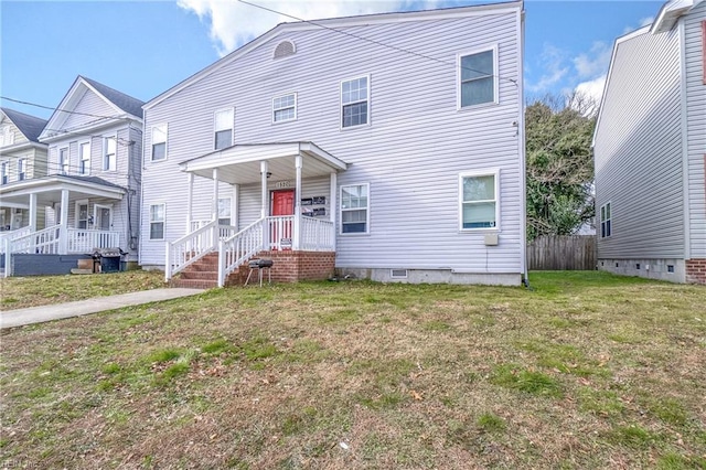 view of front of property featuring a front lawn and a porch