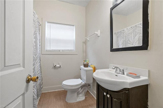 bathroom featuring toilet and vanity