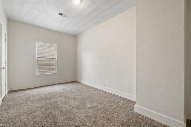 unfurnished room with carpet floors