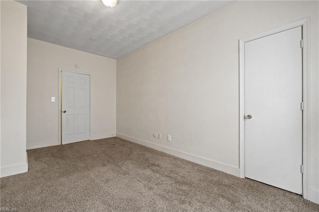 spare room featuring carpet flooring