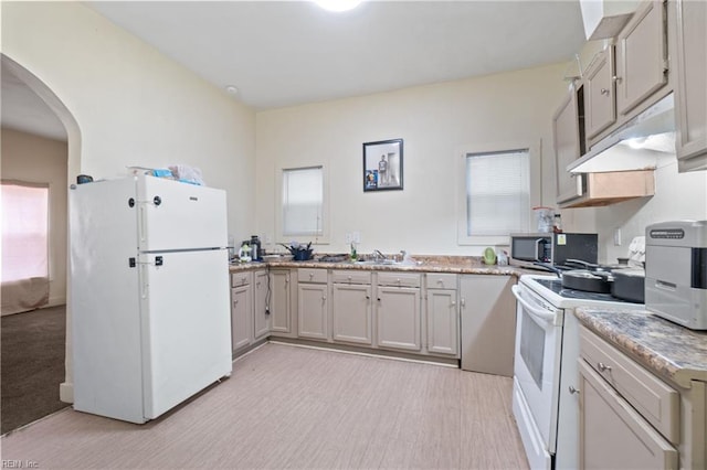 kitchen with sink and white appliances