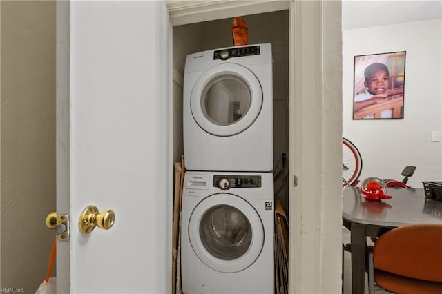 laundry area with stacked washer and clothes dryer