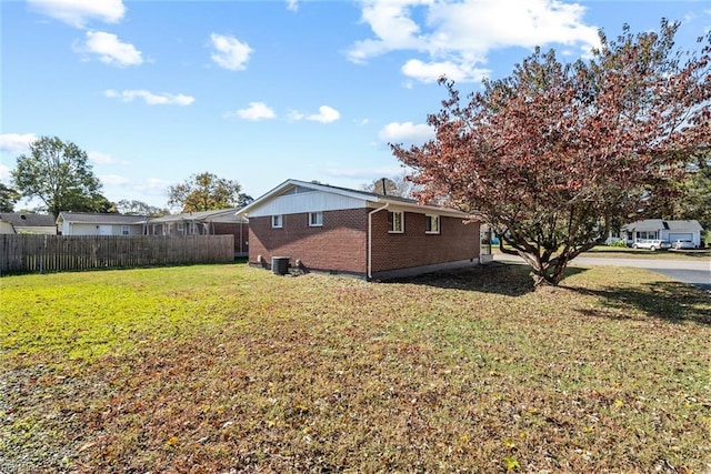 view of home's exterior with a yard