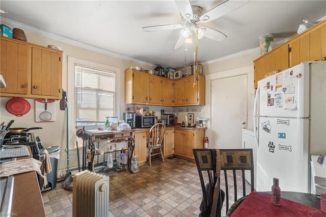 kitchen with ceiling fan, white refrigerator, and ornamental molding