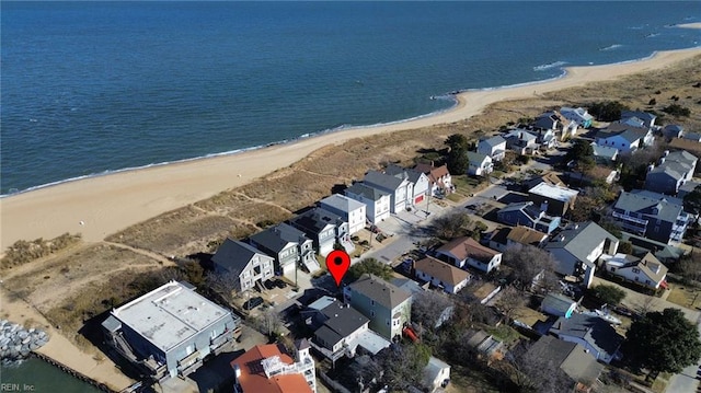 drone / aerial view featuring a water view and a view of the beach