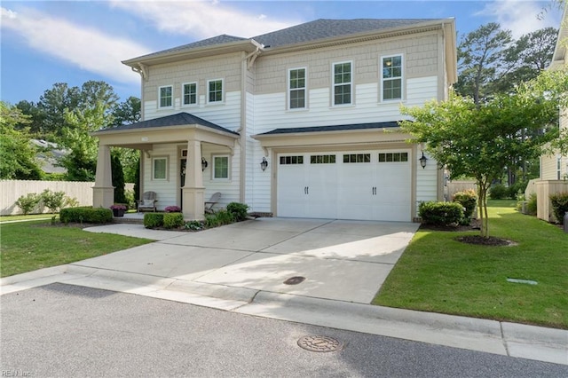 view of front of house with a garage, a porch, and a front lawn