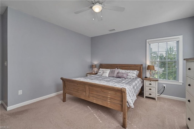 bedroom featuring ceiling fan and light carpet