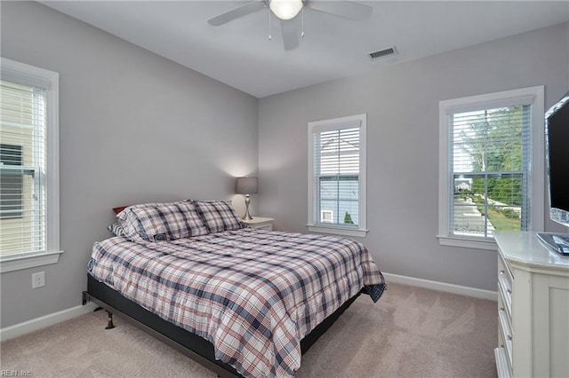 carpeted bedroom featuring ceiling fan