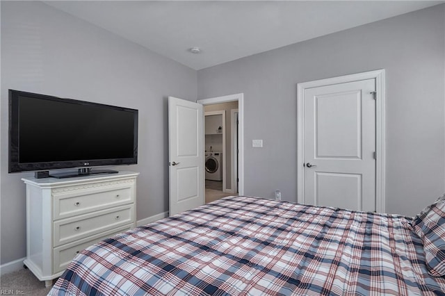 carpeted bedroom with washer / clothes dryer