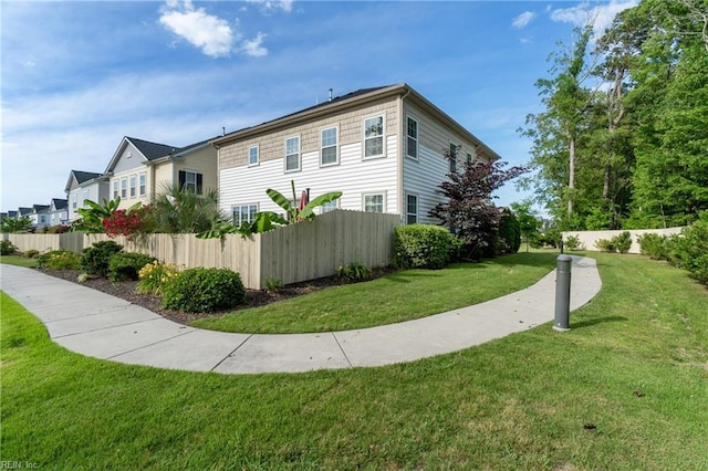 view of home's exterior with a yard