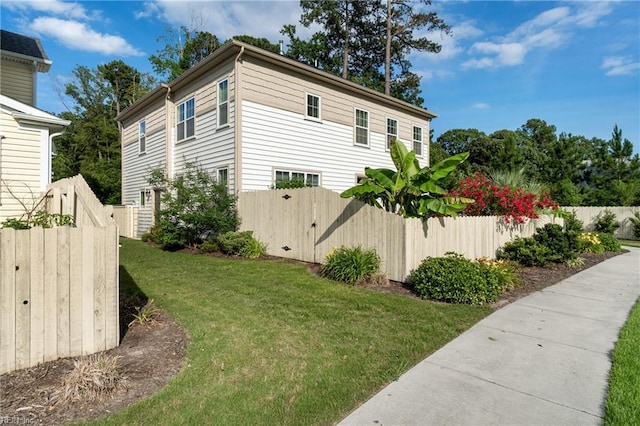 view of home's exterior featuring a lawn