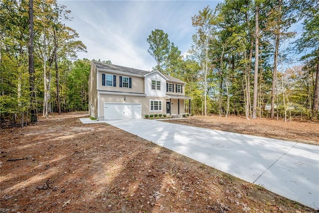 view of front of property with a garage and concrete driveway