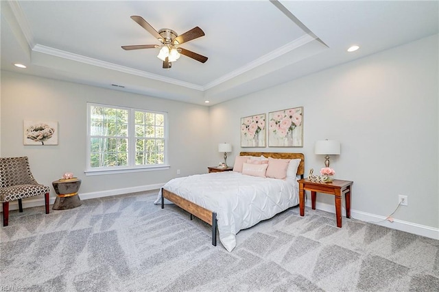 bedroom with recessed lighting, carpet flooring, baseboards, ornamental molding, and a tray ceiling