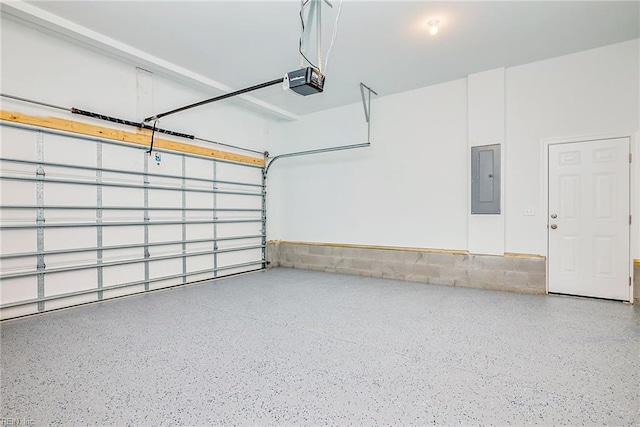 garage with electric panel and a garage door opener