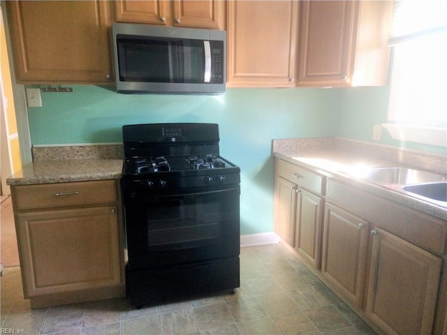 kitchen featuring black range with gas cooktop