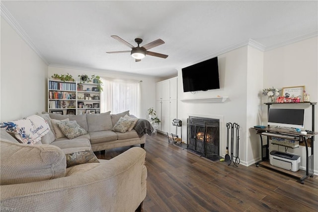 living room with ceiling fan, ornamental molding, and dark hardwood / wood-style floors