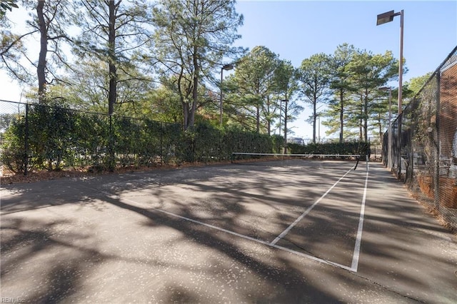 surrounding community featuring tennis court