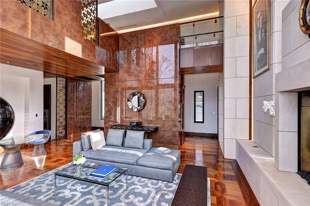 living room with a high ceiling and parquet floors