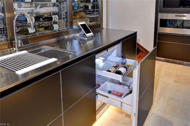 kitchen featuring sink, oven, and wall oven