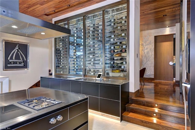 wine room with tile patterned floors and wooden ceiling