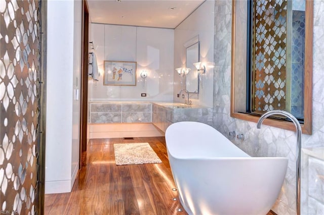 bathroom featuring hardwood / wood-style flooring and sink