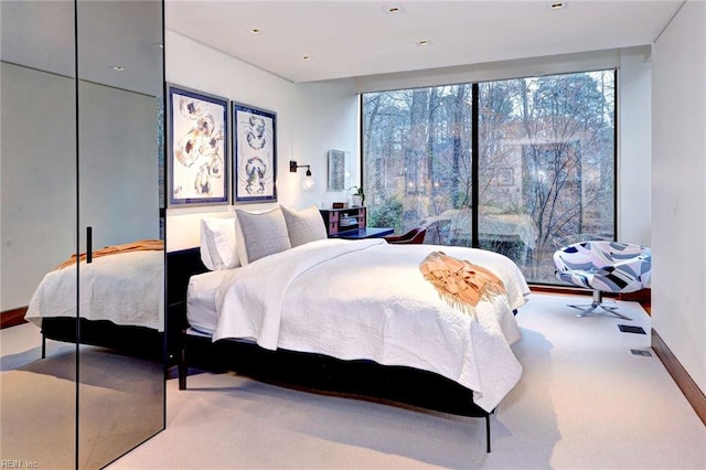 bedroom featuring light colored carpet