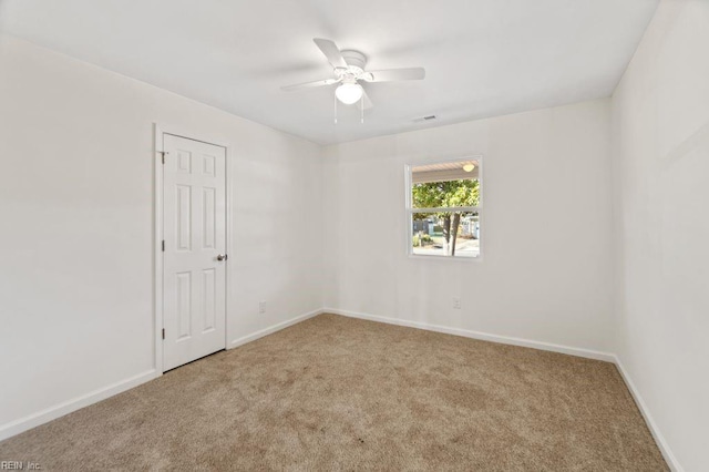 unfurnished room featuring carpet flooring and ceiling fan