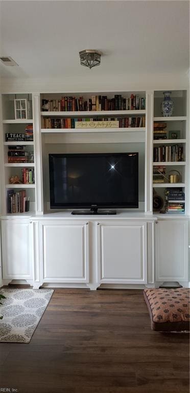 unfurnished living room featuring dark hardwood / wood-style floors