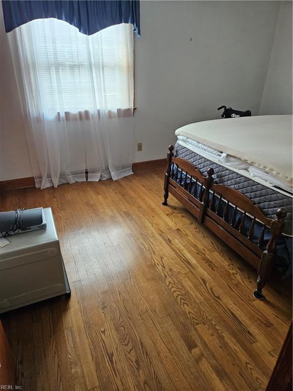 bedroom featuring light wood-type flooring