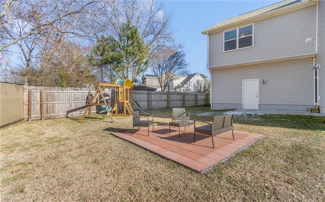 view of yard featuring a patio and a playground