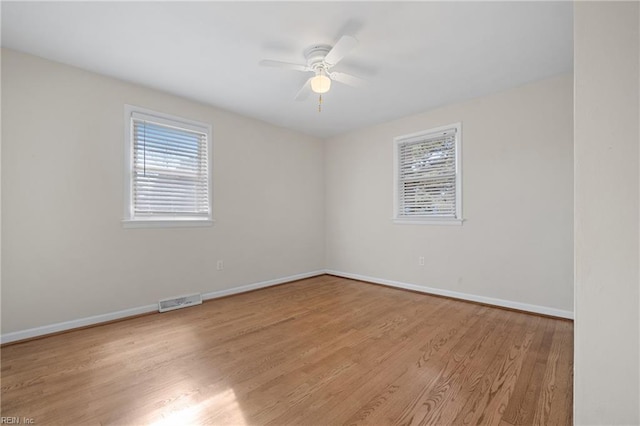 empty room featuring ceiling fan and light wood-type flooring