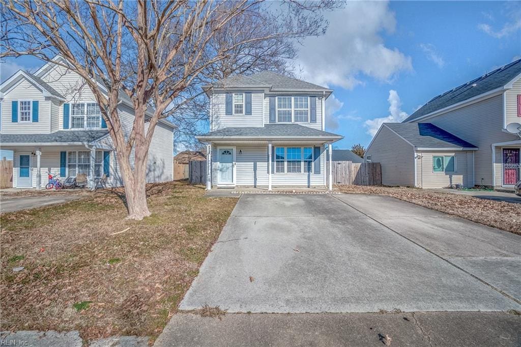 view of property with a porch and a front yard