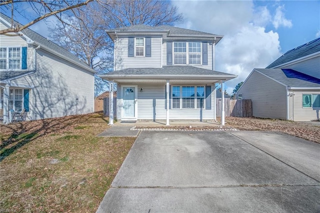 front of property with a front yard and a porch