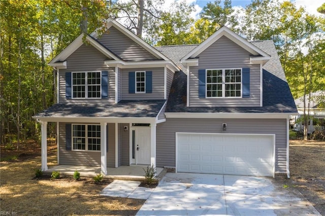 view of front of house featuring a garage and a porch