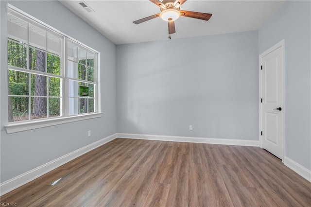 spare room with ceiling fan and hardwood / wood-style floors