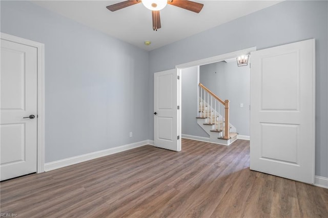 spare room with ceiling fan and hardwood / wood-style floors